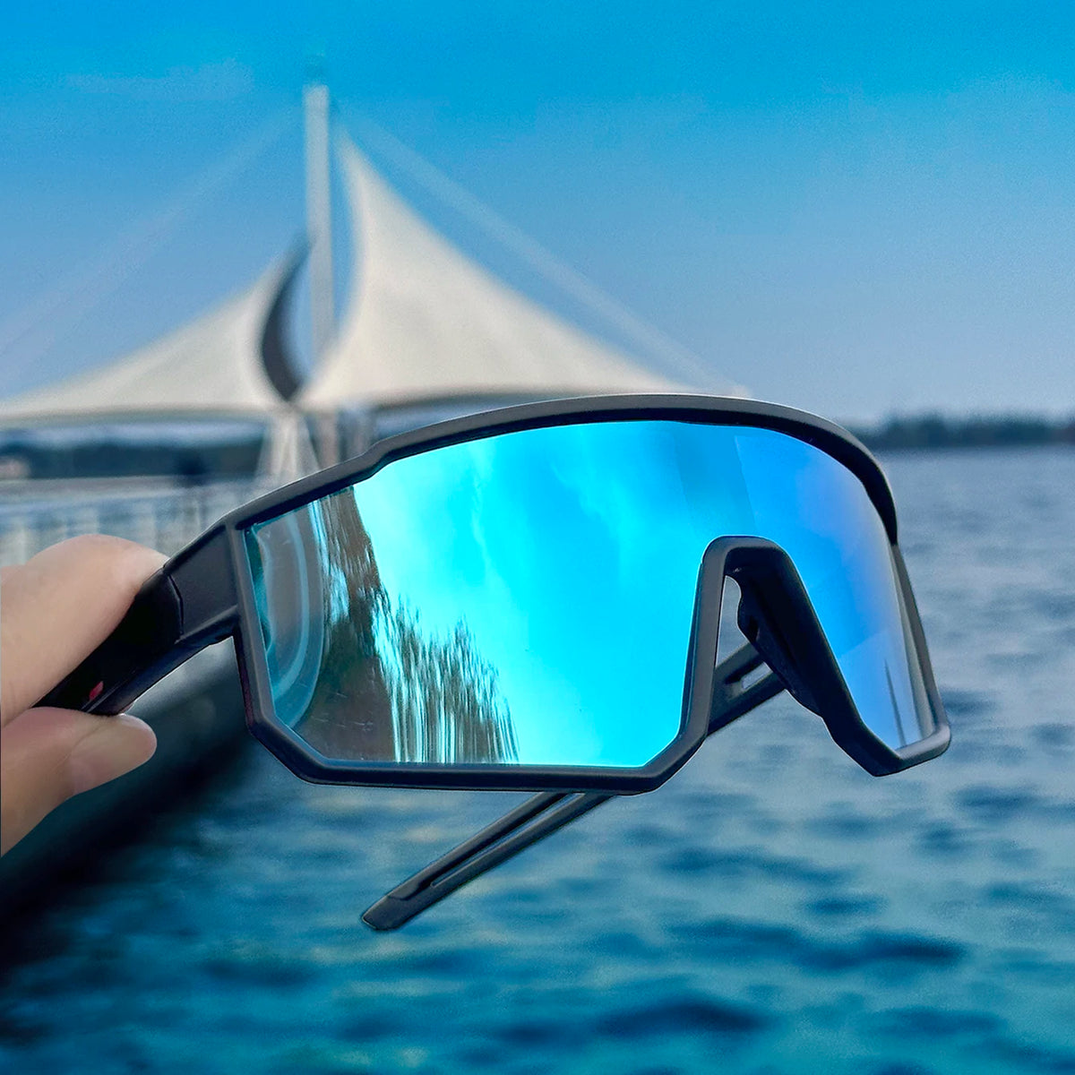 Lentes de sol deportivos cortaviento con armazón envolvente